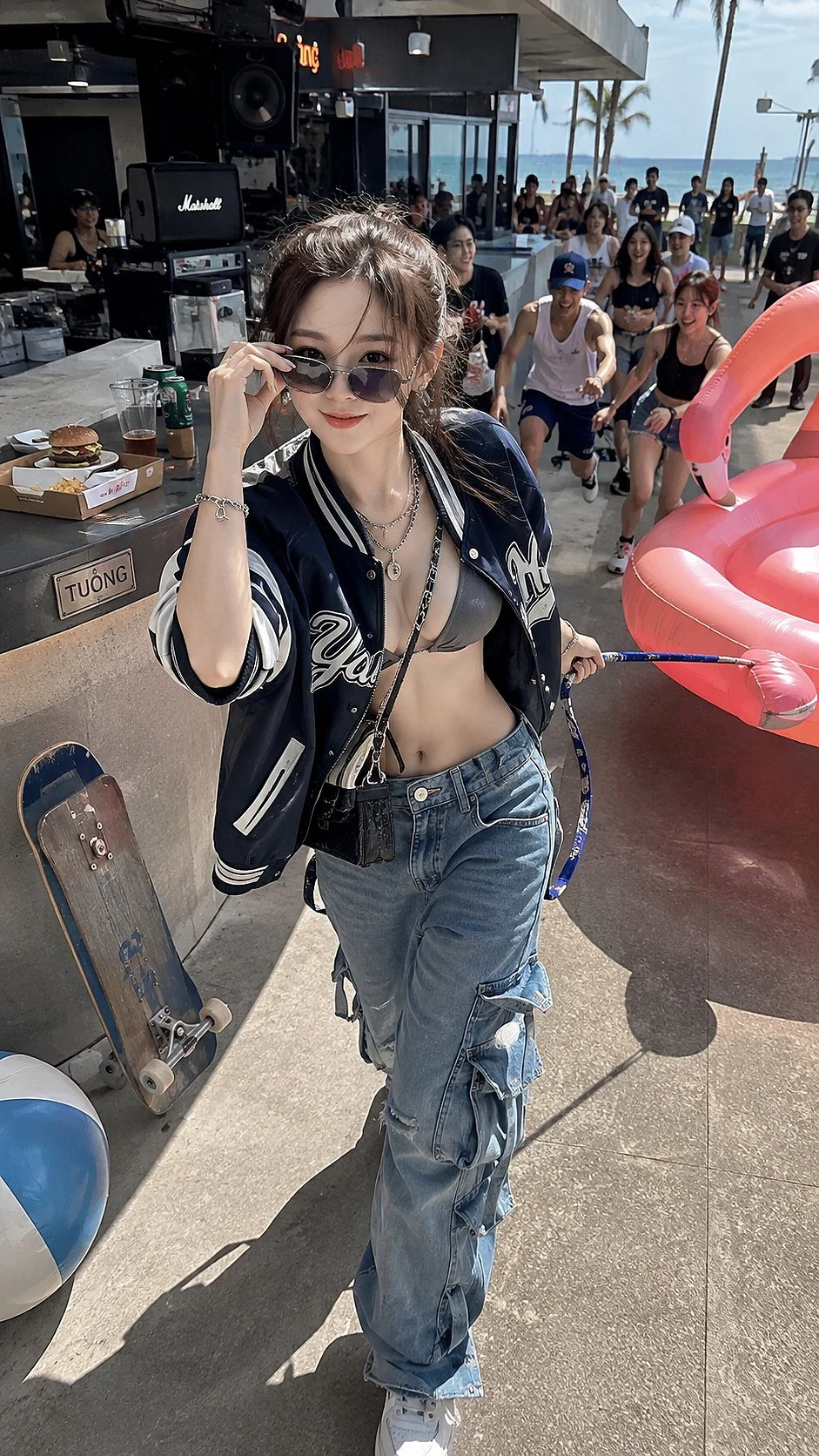 At an outdoor car event, a woman in sunglasses, a dark leather jacket and jeans poses beside cars and a crowd.
